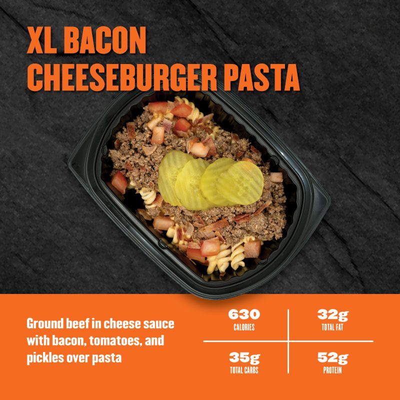 Ground beef in cheese sauce with bacon, tomatoes, and pickles over pasta; 630 calories, 32g fat, 35g carbs, 52g protein.